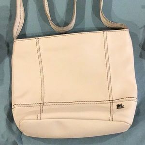 The Sak brand leather purse cream color